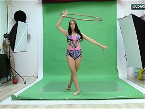 gigantic milk cans Nicole on the green screen opening up
